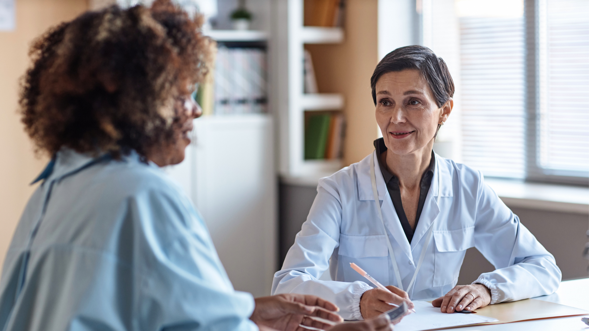 A woman talking to a doctor
